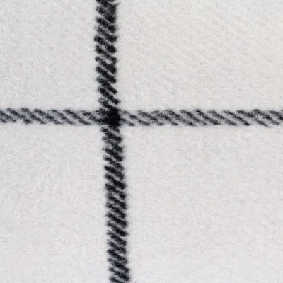 Close-up van witte stof met zwart ruitpatroon. Materiaalstructuur zichtbaar.