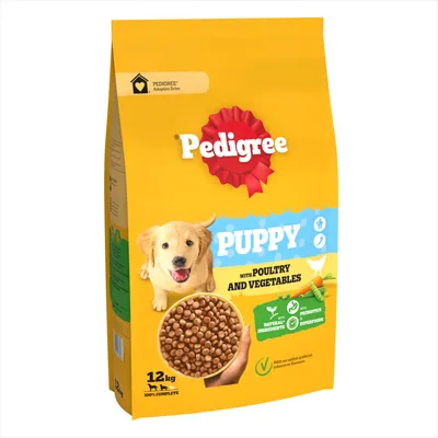 Bag labelled 'Puppy with poultry and vegetables', showing kibble, natural ingredients, prebiotics, superfoods, no added artificial colours or flavours, 12kg weight.