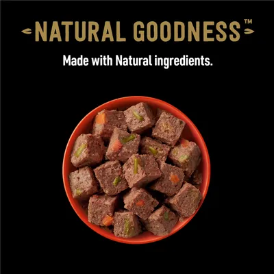 Bowl of cubed food with visible vegetables, labelled 'Natural Goodness'. Text states: Made with natural ingredients.