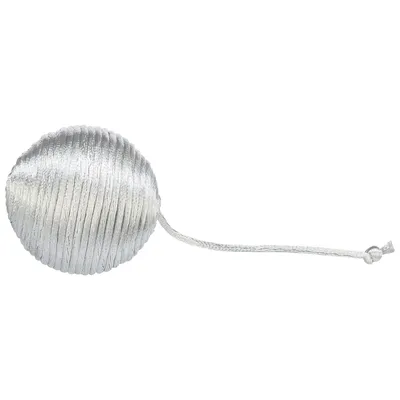 Silver ball-shaped toy with string, suitable for playing and throwing.