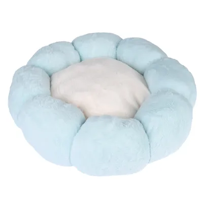 Panier rond pour animal, rebord tressé bleu clair, coussin central blanc, tissu aspect peluche visible.