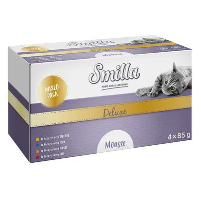 Smilla Deluxe Mousse ассорти, 4x85 г. Вкусы: курица, тунец, индейка, говядина. На упаковке изображена серая кошка и золотые акценты.