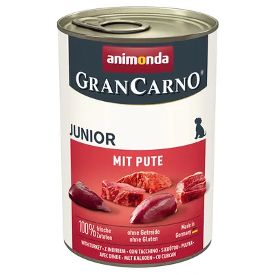 GranCarno Junior with turkey, 100% fresh ingredients, grain-free, gluten-free, made in Germany. Image shows meat pieces and key features on the can label.