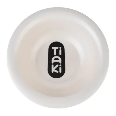 Tiaki. Valkoinen ruokakuppi, jossa musta Tiaki-logo keskellä.