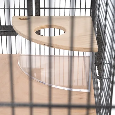Corner platform made of wood with round cut-out and transparent acrylic wall, mounted in a metal cage.