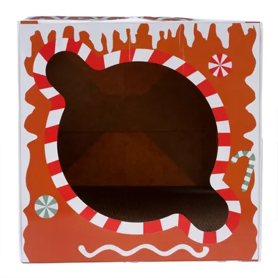 Kartonhaus mit Lebkuchen-Design, rot-weiss gestreifte Öffnung und Zuckerstangen-Muster. Innenraum sichtbar.