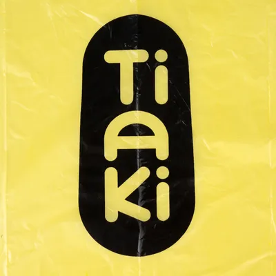 Tiaki. Merknaam op gele achtergrond.