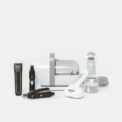 kooa. Set of various grooming tools for pets, including trimmer, brush, vacuum and accessories in white and black.