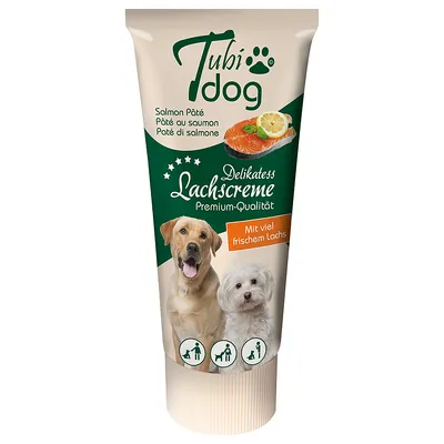 Tubi Dog Delikatess Lachscreme Premium-Qualität, Salmon Pâté, Mit viel frischem Lachs. Kuvassa lohta ja kaksi koiraa. Tekstit englanniksi, ranskaksi, italiaksi ja saksaksi.