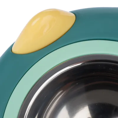 Close-up of a feeding bowl with stainless steel inner dish and coloured plastic rim in yellow, green and turquoise.