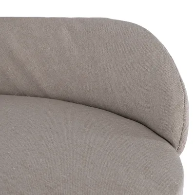 Close-up van beige gevoerd textielmateriaal, geschikt voor meubels of huisdierenbedden.
