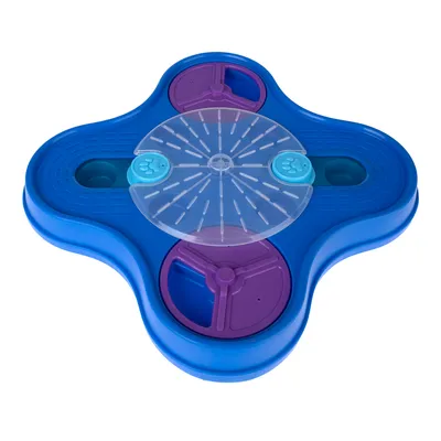 Jouet interactif pour animaux en plastique bleu et violet, avec plateau central transparent et compartiments rotatifs visibles.