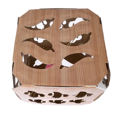 Cardboard with wood look and cut-out leaf shapes, suitable as a play or hiding place for pets.