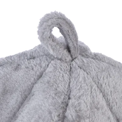 Close-up of grey, soft plush material with a loop at the top. Suitable for product description or material display.