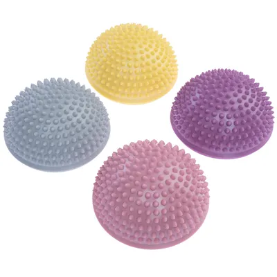 Quattro palline da massaggio semisferiche con nodi in giallo, viola, rosa e grigio. Adatte per massaggi o attività di gioco.