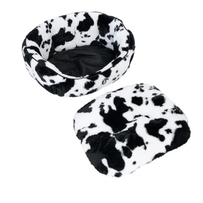 Round pet bed with removable cushion, black and white cow pattern, soft material.