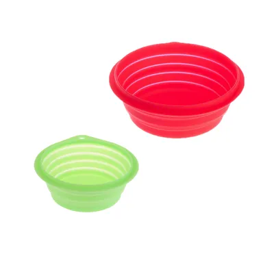 Two foldable silicone bowls in red and green, suitable for travel or on the go.