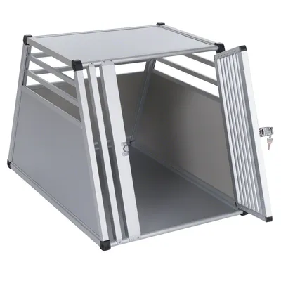 Transportbur i aluminium med galler, låsbar dörr och trapetsformad design. Lämplig för säker transport av husdjur.