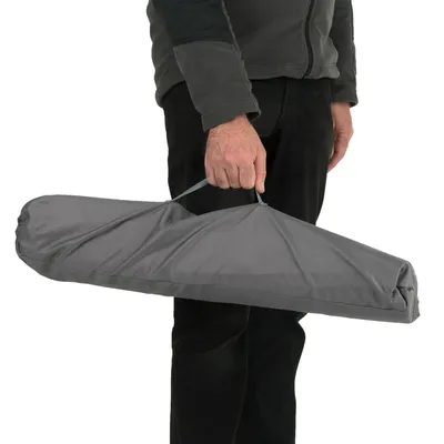 Grey carry bag with handle, held in a person's hand. Suitable for transporting a foldable product.