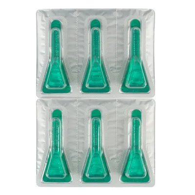 Plaquette de 6 pipettes unidoses en plastique transparent contenant un liquide vert, emballées individuellement sous blister argenté. Aucun texte ou marque visible.