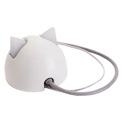 White dome-shaped device with two pointed ears and an attached grey cable, shown from the back to display the cable connection.