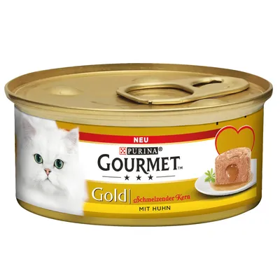 Purina Gourmet Gold, sulava ydin kanan kanssa. Uusi resepti kultaisessa purkissa, kuva valkoisesta kissasta ja tarjoillusta pateesta nestemäisellä ytimellä.