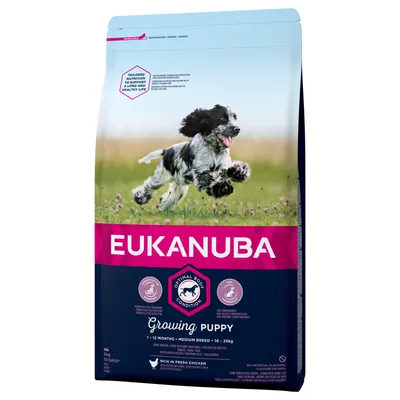 Saco de pienso Eukanuba Growing Puppy para cachorros de 1–12 meses, razas medianas 10–25 kg. Texto visible: Optimal Body Condition, Rich in Fresh Chicken.