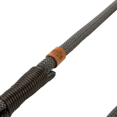 Grey braided rope with brown leather detail and Trixie logo.
