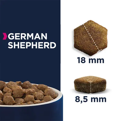 Kibble dimensions for German Shepherd: pentagon-shaped pieces shown with measurements, 18 mm across and 8.5 mm thick, alongside a bowl filled with the kibble.