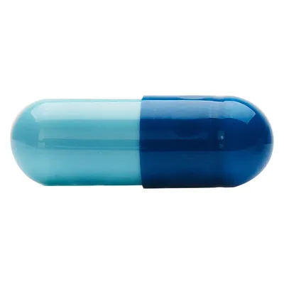 Gélule bicolore bleu clair et bleu foncé, sans marque ni texte visible, présentée sur fond blanc.