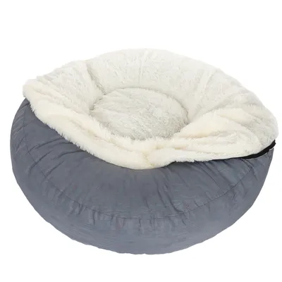 Rond, grijs huisdierenbed met zachte, witte pluche vulling en verhoogde rand.