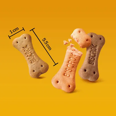 Biscrok kutyakeksz csont alakban, hossza 5,5 cm, szélessége 1 cm. Három szín: bézs, narancs és barna. Egy keksz törött.