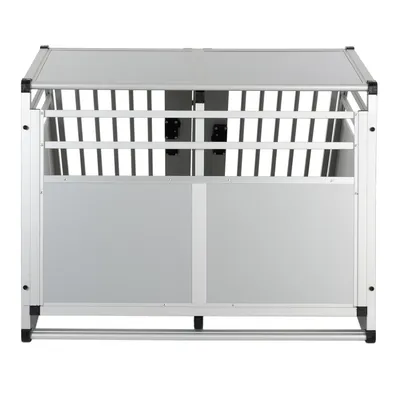 Box per animali in metallo e pannelli grigi, struttura rettangolare con barre laterali e divisorio centrale visibile.