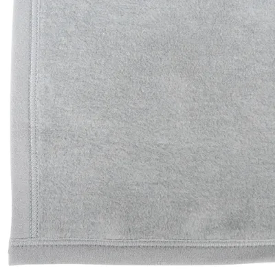 Grey fabric with a soft surface and visible seam at the edge.