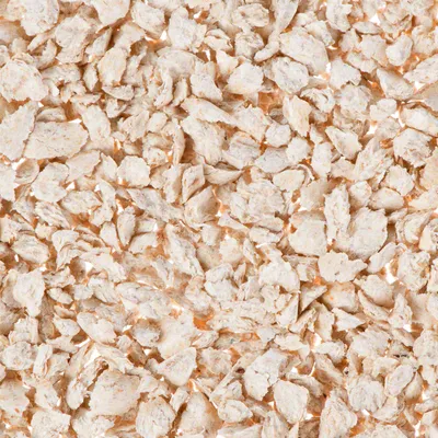 Close-up of light, dried flakes. Product image shows the texture and shape of the flakes.
