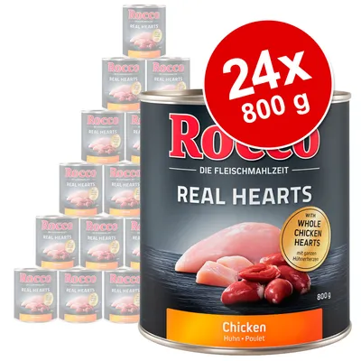Rocco Real Hearts Chicken, 24 x 800 g burkar. Text: 'WITH WHOLE CHICKEN HEARTS', 'Chicken Huhn Poulet'. Bild på kycklingkött och hjärtan på förpackningen.