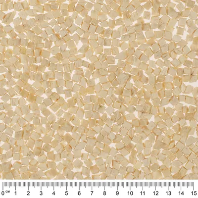Cubetti beige chiari disposti su superficie bianca, ciascuno di circa 0,5 cm, con righello in basso che mostra scala da 0 a 15 cm.