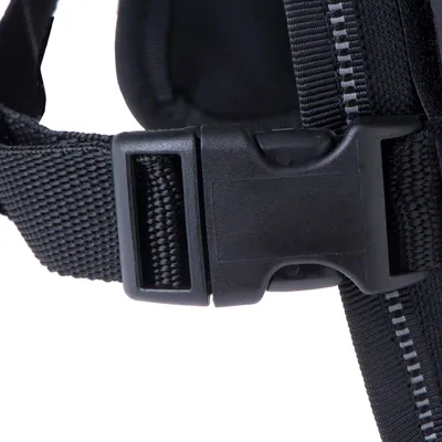 Close-up of a black plastic click fastener on a durable nylon strap.