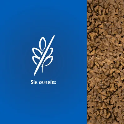 Pienso en forma de croquetas junto al texto 'Sin cereales' y un símbolo de espiga tachada, indicando ausencia de cereales en el producto.