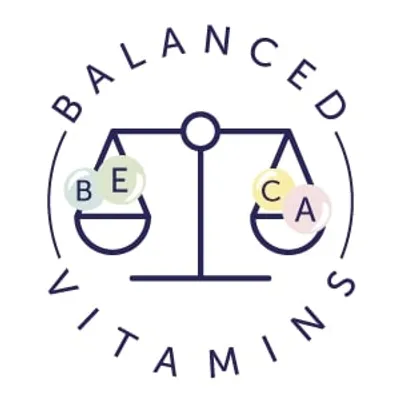 Testo in inglese: BALANCED VITAMINS con disegno di bilancia e lettere BE, CA su piatti diversi. Testo non disponibile altrove.