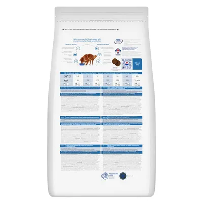 Tabela dawkowania karmy dla psów: waga psa od 2,5 do 50+ kg, dzienne porcje od 60 do 510 g. Widoczne instrukcje i teksty w kilku językach oraz kod QR.