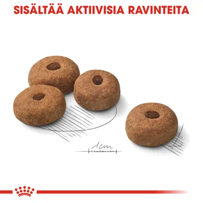 Neljä rengasmaista kuivaruokanappulaa, alla mittaviiva 1 cm. Ylhäällä punaisella teksti: SISÄLTÄÄ AKTIIVISIA RAVINTEITA.