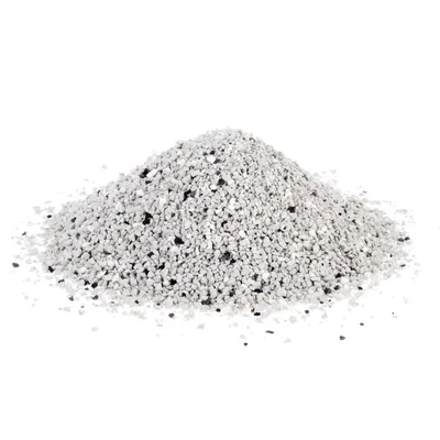 Pile of white and grey granules with scattered black particles, possibly cat litter.