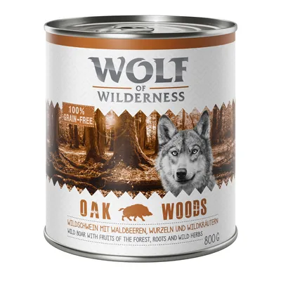 Lata de Wolf of Wilderness Oak Woods, 800 g, 100% grain-free. Texto visible: wild boar with fruits of the forest, roots and wild herbs. Imagen de bosque y silueta de animal.