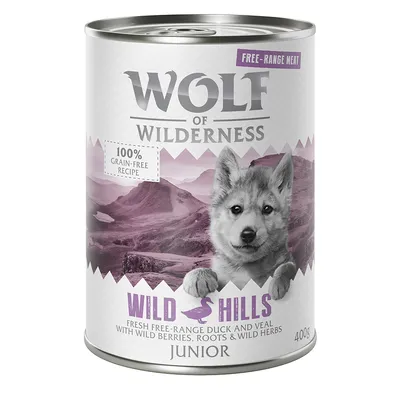Wolf of Wilderness Junior Wild Hills, 400 g tölkki. Resepti vapaana kasvatetulla ankalla ja vasikalla, marjoja, juuria ja yrttejä. 100 % viljaton.
