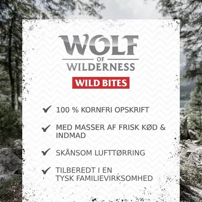 Wolf of Wilderness Wild Bites. 100 % kornfri opskrift, med masser af frisk kød & indmad, skånsom lufttørring, tilberedt i en tysk familievirksomhed.