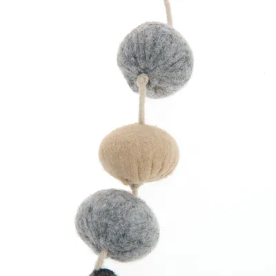 Toy made of felt balls in grey and beige, connected by a string.