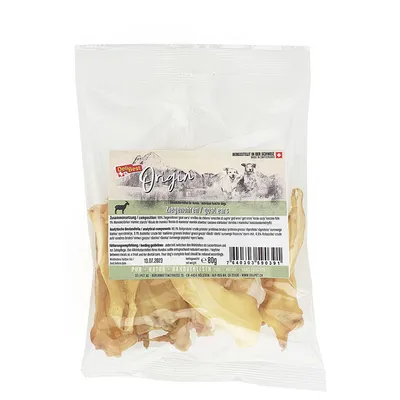 DeliBest Origin козьи уши, 80 г. Видна прозрачная упаковка с ушами, этикетка с текстом на нескольких языках, штрихкод, дата 13.07.2023, страна производства Швейцария.