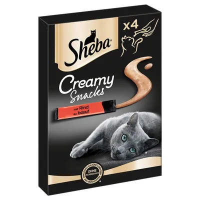 Sheba Creamy Snacks x4, mit Rind au bœuf, sans sucres ajoutés ni arômes artificiels, image d’un chat gris allongé sur l’emballage noir et or.