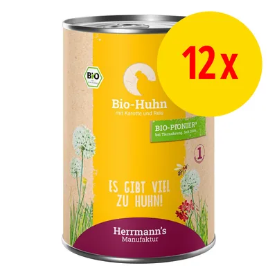 Lot de 12 boîtes Herrmann's Manufaktur Bio-Huhn mit Karotte und Reis, texte en allemand : Es gibt viel zu Huhn!, labels BIO et BIO-PIONIER visibles sur l’emballage.